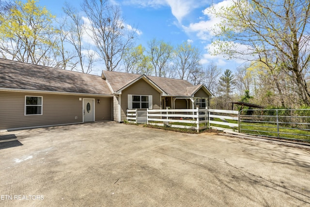 view of front of house featuring fence