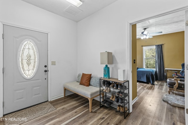 foyer with visible vents and wood finished floors