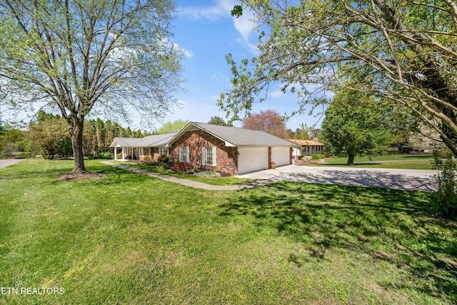 230 Briarcliff Ave, Oak Ridge, TN 37830 - ranch-style house featuring a front yard, brick siding, a garage, and driveway