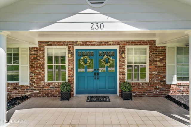 230 Briarcliff Ave, Oak Ridge, TN 37830 - doorway to property with brick siding and a porch