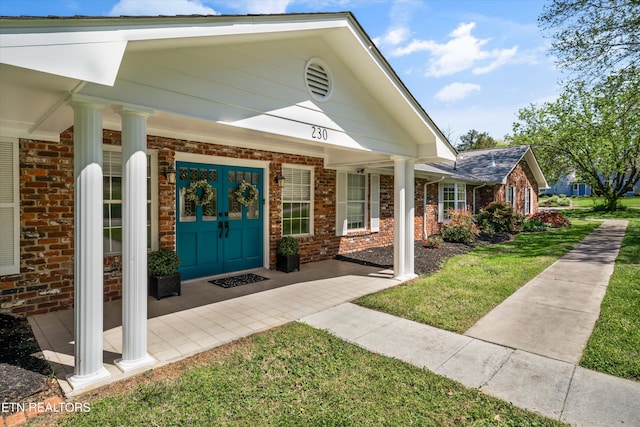 230 Briarcliff Ave, Oak Ridge, TN 37830 - property entrance featuring brick siding and covered porch
