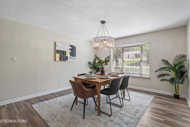 230 Briarcliff Ave, Oak Ridge, TN 37830 - dining space with a chandelier, baseboards, and wood finished floors