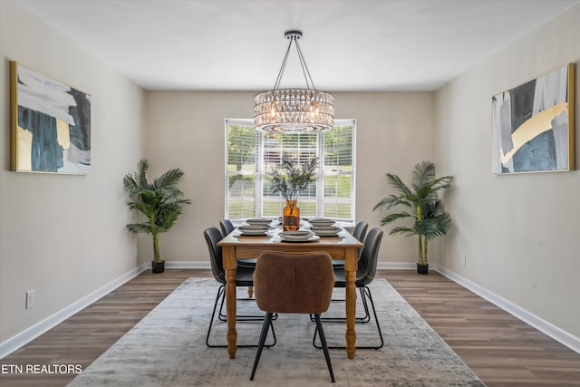 230 Briarcliff Ave, Oak Ridge, TN 37830 - dining space featuring wood finished floors, an inviting chandelier, and baseboards