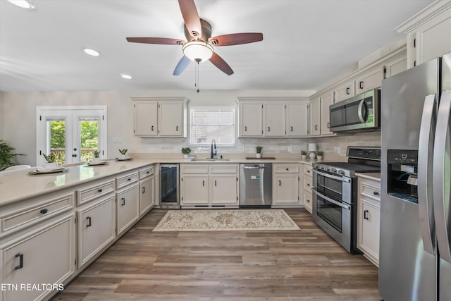 230 Briarcliff Ave, Oak Ridge, TN 37830 - kitchen featuring a ceiling fan, recessed lighting, a sink, beverage cooler, and stainless steel appliances