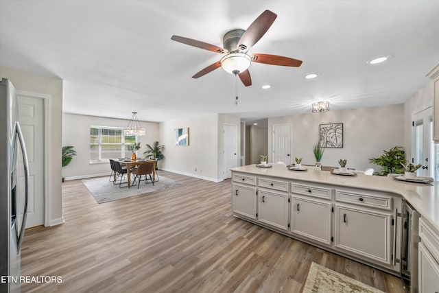 230 Briarcliff Ave, Oak Ridge, TN 37830 - kitchen with light wood-type flooring, stainless steel fridge, recessed lighting, a peninsula, and ceiling fan
