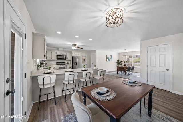 230 Briarcliff Ave, Oak Ridge, TN 37830 - dining space with ceiling fan with notable chandelier, dark wood-style flooring, baseboards, and recessed lighting