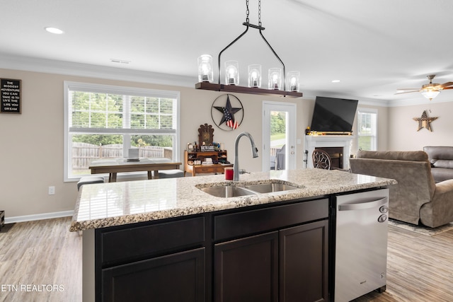 5811 Rain Cloud Rd, Knoxville, TN 37918 - kitchen featuring a fireplace, light wood-type flooring, crown molding, light stone counters, and open floor plan