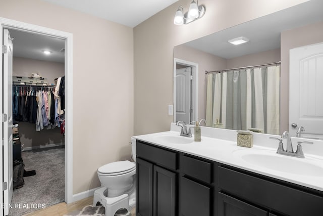 5811 Rain Cloud Rd, Knoxville, TN 37918 - full bathroom featuring double vanity, a walk in closet, wood finished floors, and curtained shower