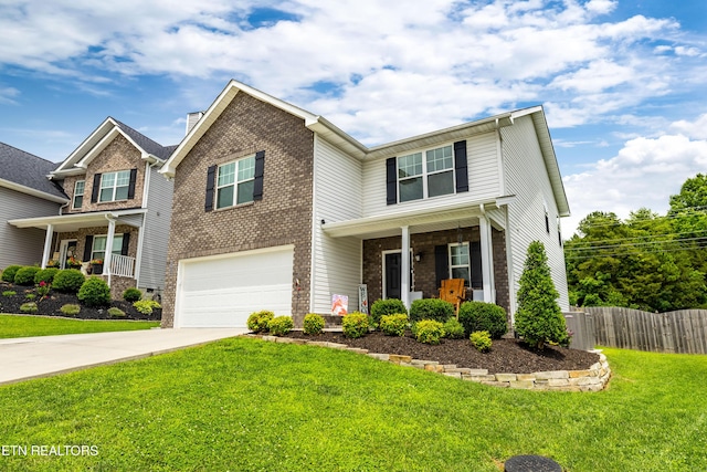5811 Rain Cloud Rd, Knoxville, TN 37918 - view of front of house featuring covered porch, brick siding, and a garage