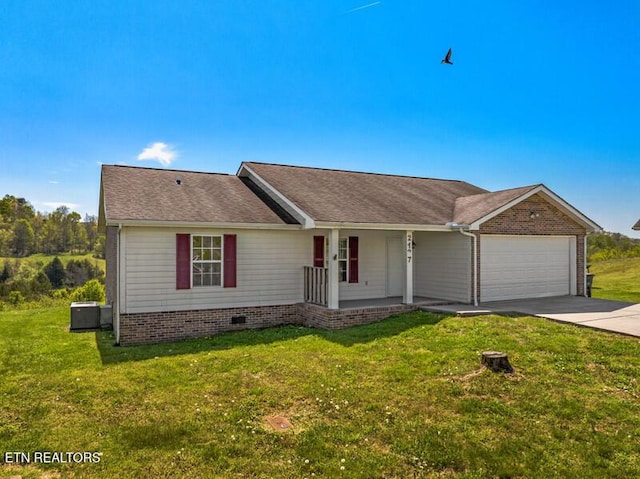 single story home with a porch, an attached garage, concrete driveway, and a front yard