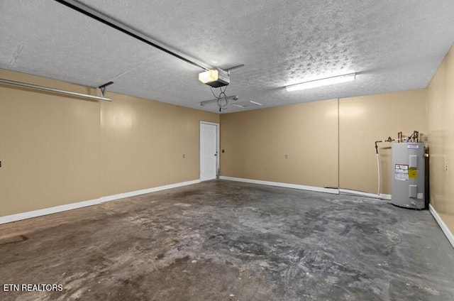 garage featuring baseboards, a garage door opener, and electric water heater