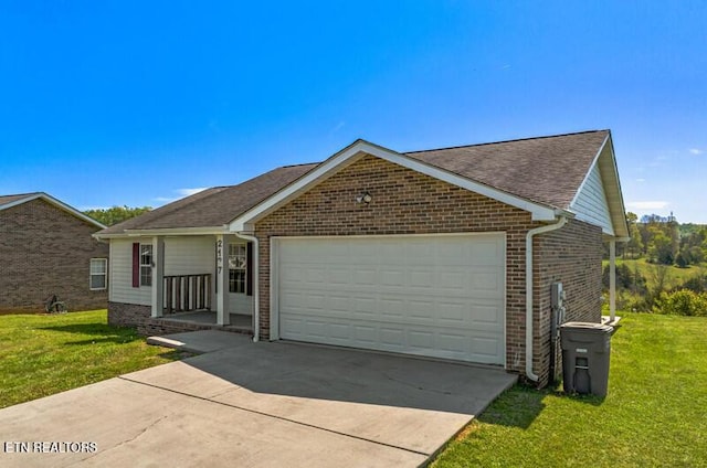 ranch-style house featuring a shingled roof, an attached garage, brick siding, a front yard, and concrete driveway