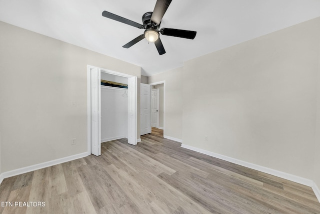 9204 Chamaeleon Trl, Harrison, TN 37341 - unfurnished bedroom featuring a closet, light wood finished floors, and baseboards