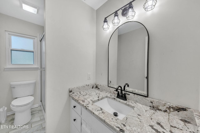9204 Chamaeleon Trl, Harrison, TN 37341 - full bath with a shower with shower door, toilet, vanity, and baseboards