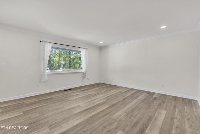 9204 Chamaeleon Trl, Harrison, TN 37341 - empty room with wood finished floors, baseboards, ornamental molding, and visible vents