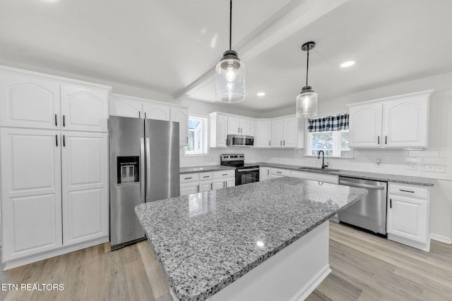 9204 Chamaeleon Trl, Harrison, TN 37341 - kitchen featuring light stone counters, a sink, white cabinets, and stainless steel appliances