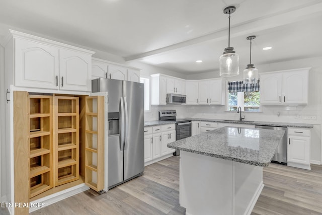 9204 Chamaeleon Trl, Harrison, TN 37341 - kitchen featuring white cabinets, a sink, beam ceiling, and appliances with stainless steel finishes
