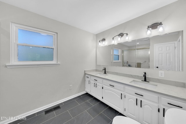 9204 Chamaeleon Trl, Harrison, TN 37341 - full bathroom with a sink, visible vents, tile patterned floors, and a shower stall