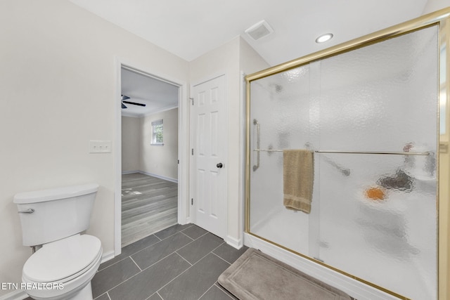 9204 Chamaeleon Trl, Harrison, TN 37341 - full bathroom with a shower stall, tile patterned flooring, visible vents, toilet, and baseboards