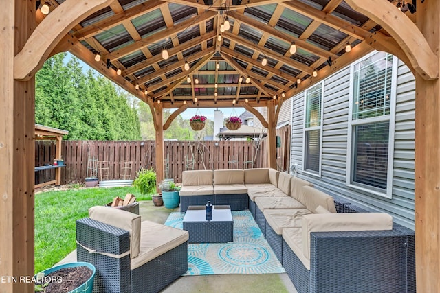 view of patio with an outdoor hangout area and fence private yard