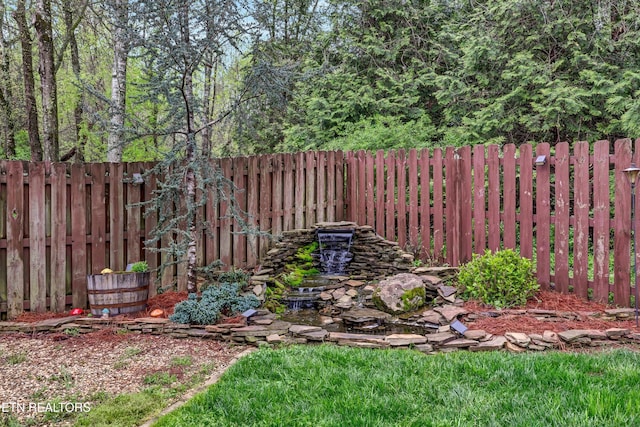 view of yard with a fenced backyard