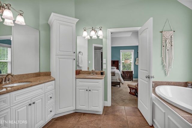 bathroom featuring a sink, a wealth of natural light, and an inviting chandelier