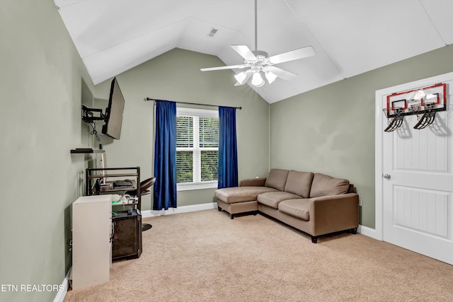 carpeted living area with baseboards, vaulted ceiling, and ceiling fan