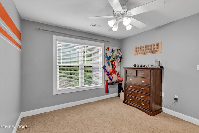 bedroom with carpet, visible vents, baseboards, and ceiling fan