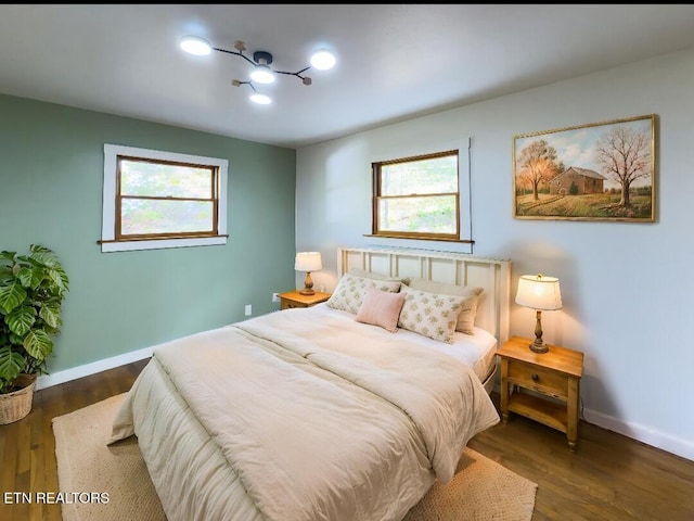 355 E Chestnut Hill Rd, Townsend, TN 37882 - bedroom featuring baseboards, multiple windows, and wood finished floors