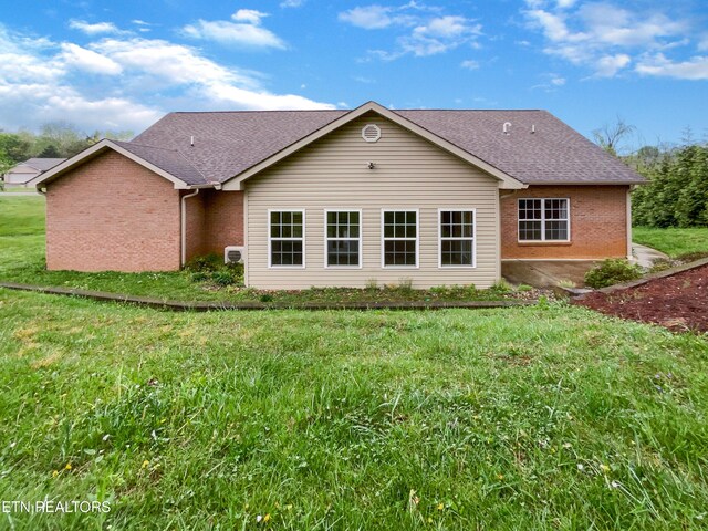 1056 Willow Creek Cir, Maryville, TN 37804 - back of house featuring roof with shingles, a lawn, and brick siding