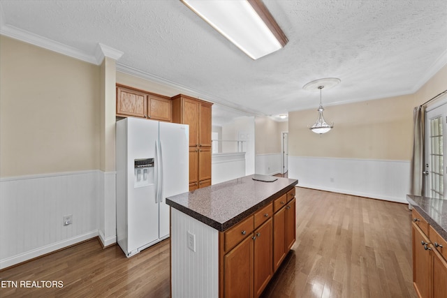 102 Chaloni Ln, Loudon, TN 37774 - kitchen with wainscoting, a textured ceiling, and white fridge with ice dispenser