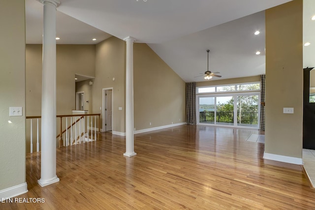 304 Coweta Ct, Loudon, TN 37774 - unfurnished living room featuring ornate columns, light wood finished floors, a ceiling fan, and high vaulted ceiling