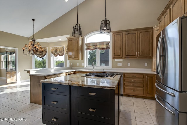304 Coweta Ct, Loudon, TN 37774 - kitchen featuring an inviting chandelier, light tile patterned floors, stainless steel appliances, a center island, and a peninsula