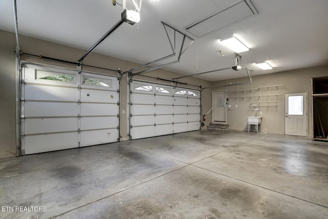 304 Coweta Ct, Loudon, TN 37774 - garage featuring a garage door opener