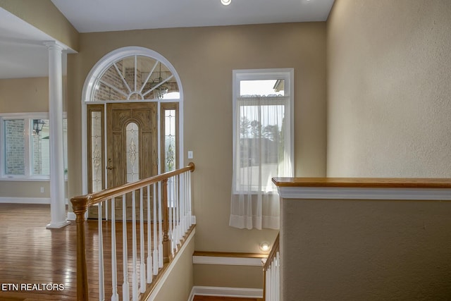 304 Coweta Ct, Loudon, TN 37774 - foyer with ornate columns, wood finished floors, a textured wall, and baseboards