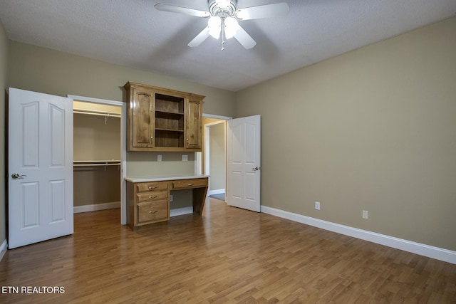 304 Coweta Ct, Loudon, TN 37774 - unfurnished bedroom with baseboards, a ceiling fan, light wood-style floors, and a closet