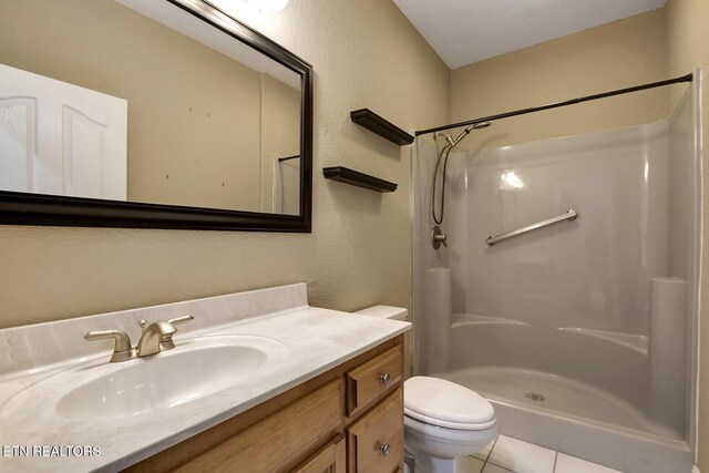 304 Coweta Ct, Loudon, TN 37774 - bathroom with a shower, vanity, toilet, and tile patterned flooring