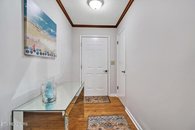 13 Oxford Cir, Fairfield Glade, TN 38558 - doorway to outside featuring baseboards, crown molding, and wood finished floors