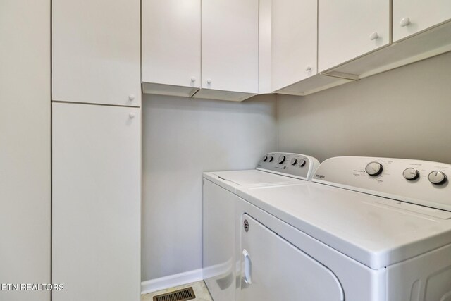 13 Oxford Cir, Fairfield Glade, TN 38558 - laundry room featuring separate washer and dryer, visible vents, baseboards, and cabinet space