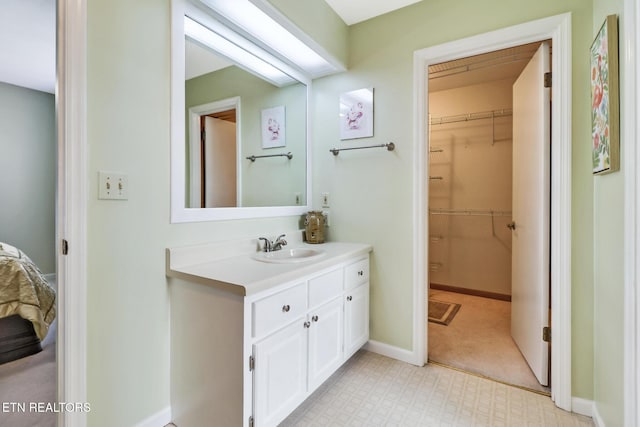 13 Oxford Cir, Fairfield Glade, TN 38558 - full bath featuring tile patterned floors, a walk in closet, vanity, and baseboards