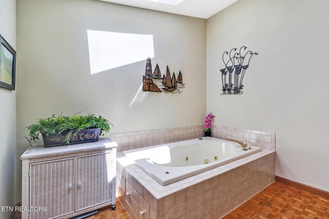 13 Oxford Cir, Fairfield Glade, TN 38558 - full bath featuring a skylight, a jetted tub, and baseboards