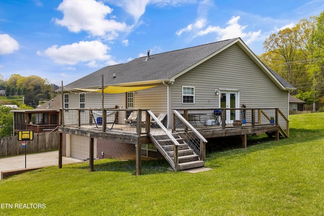 4716 Cabbage Ln, Knoxville, TN 37938 - back of property with concrete driveway, french doors, a wooden deck, a garage, and a yard