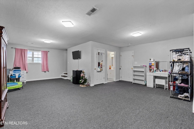 4716 Cabbage Ln, Knoxville, TN 37938 - interior space featuring dark carpet, a textured ceiling, baseboards, and visible vents