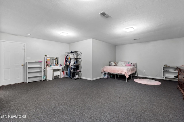 4716 Cabbage Ln, Knoxville, TN 37938 - bedroom with dark colored carpet, visible vents, a textured ceiling, and baseboards