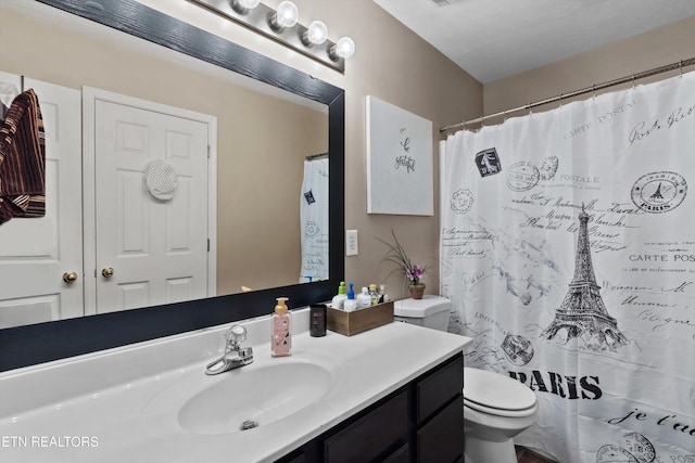 4716 Cabbage Ln, Knoxville, TN 37938 - bathroom with a shower with shower curtain, vanity, and toilet