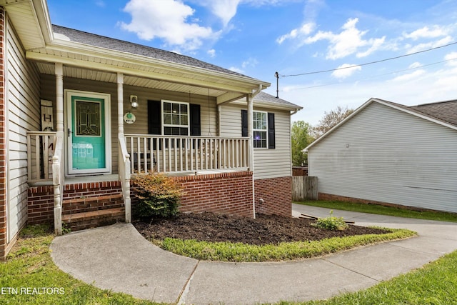 4716 Cabbage Ln, Knoxville, TN 37938 - doorway to property featuring a porch and roof with shingles
