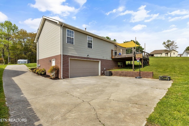 4716 Cabbage Ln, Knoxville, TN 37938 - rear view of house with cooling unit, a yard, stairs, an attached garage, and concrete driveway