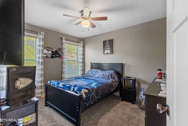 carpeted bedroom with a ceiling fan