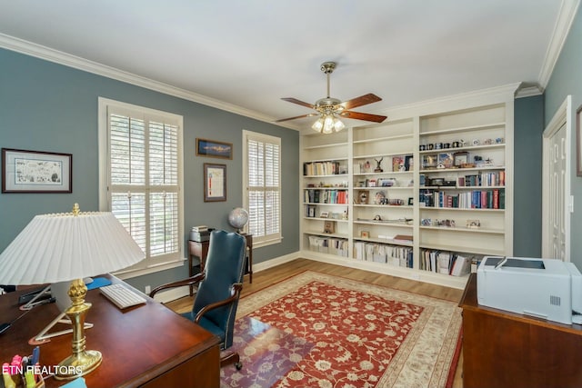 home office with wood finished floors, ornamental molding, a ceiling fan, and built in features