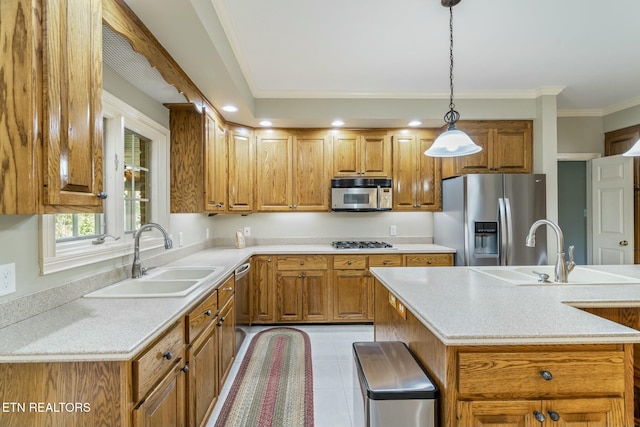kitchen featuring a sink, brown cabinets, and stainless steel appliances